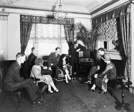 People gathered around to listen to the radio in the 1920s and 30s