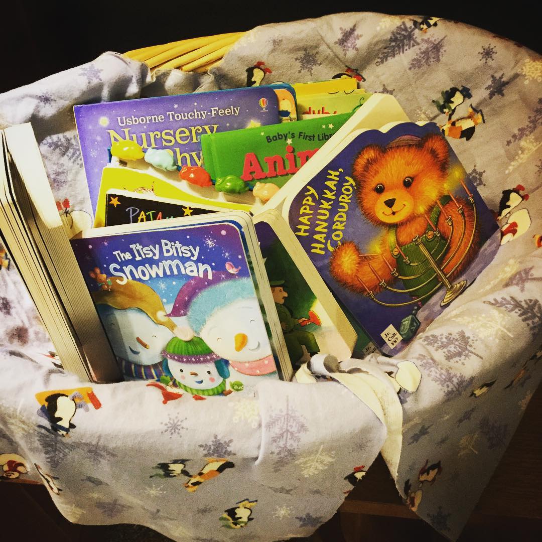 A new selection of board books are available in the children's book section - this lovely basket is kept low to the ground so our younger patrons can select their own favorites. #ohrstromlibrary #boardbooks #newbooks #childrensbooks #holidaybooks #bookdisplay #iamsps #littlereaders